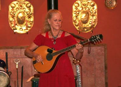 Barbara playing bouzouki